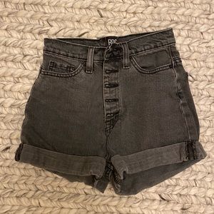 High waisted black denim shorts.